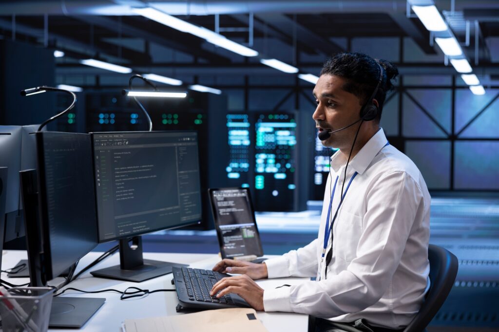 Worker in server hub call center carrying out operational interventions